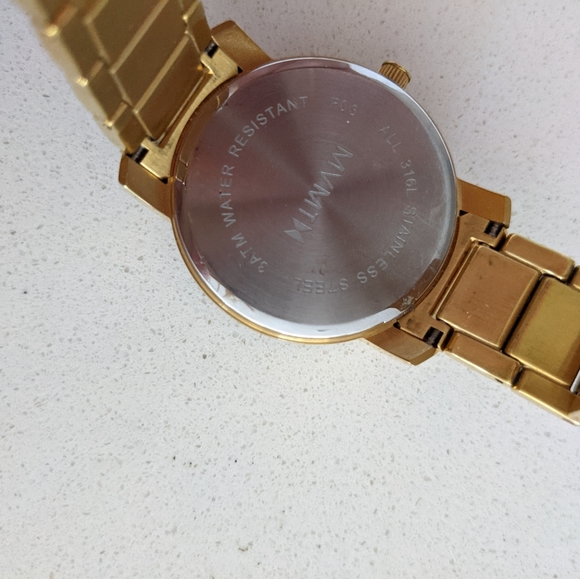 Gold MVMT watch with pearl face - Picture 3 of 3